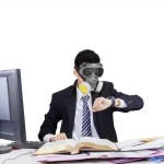 Employee wearing gas mask in workplace