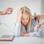 Work issues: woman overloaded with stuff at work