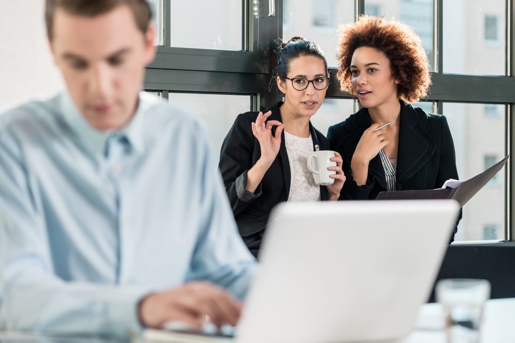 picture showing employees very close together as an example of how to manage employees as they return to work from lockdown