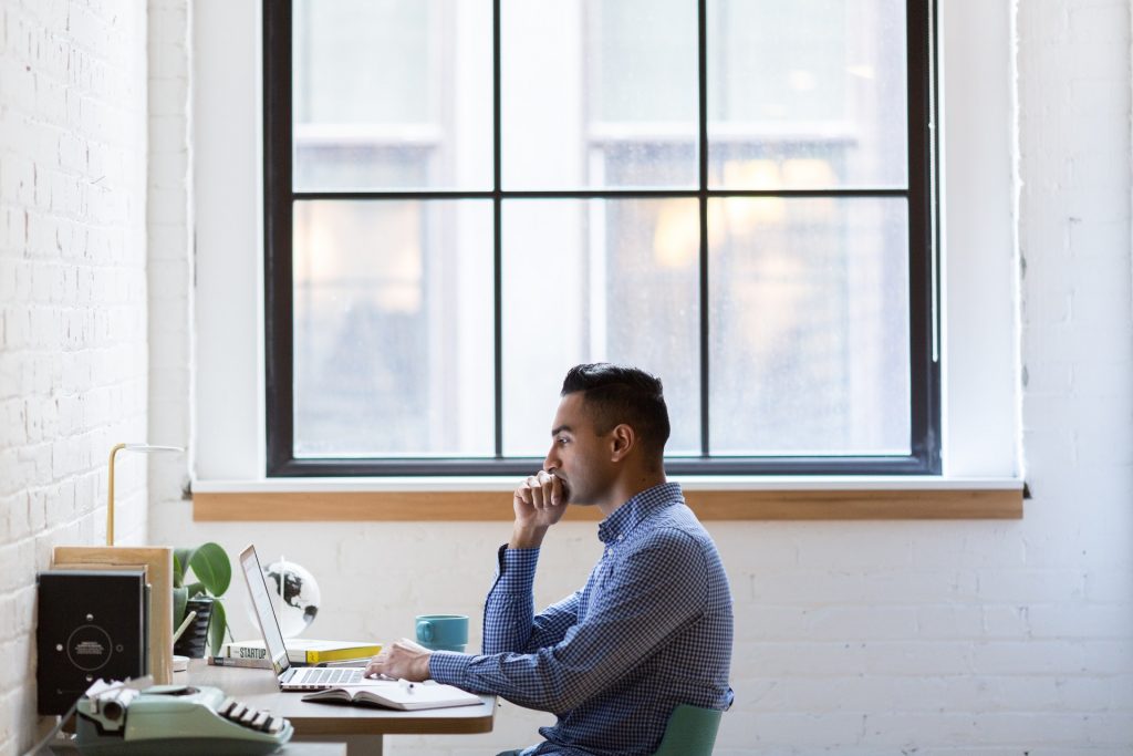 image of a man anxiously at a desk for blog by Metis HR on common HR issues 