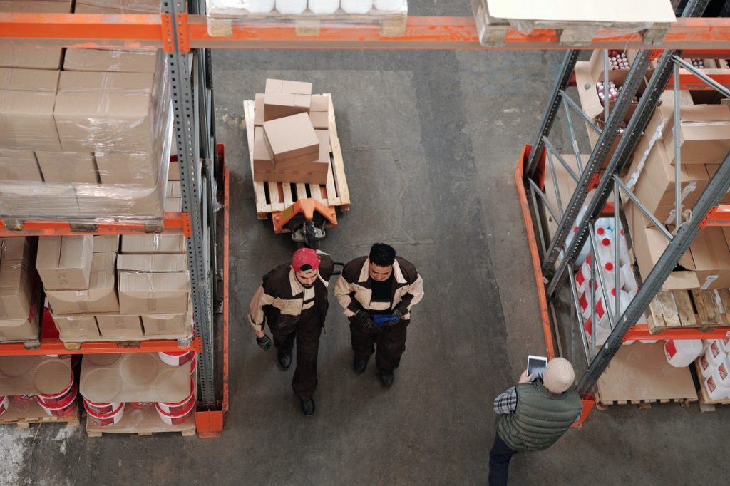 two people in a warehouse taken from above representing workplace inclusion for blog by Metis HR 