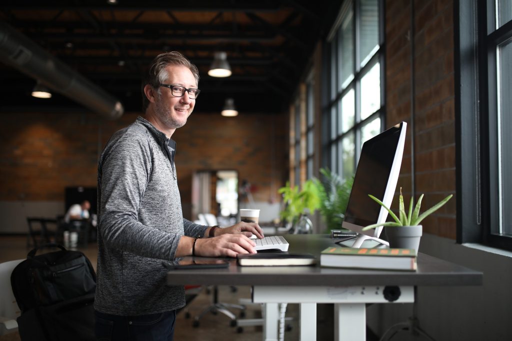 an image of an older man in the workplace at his desk