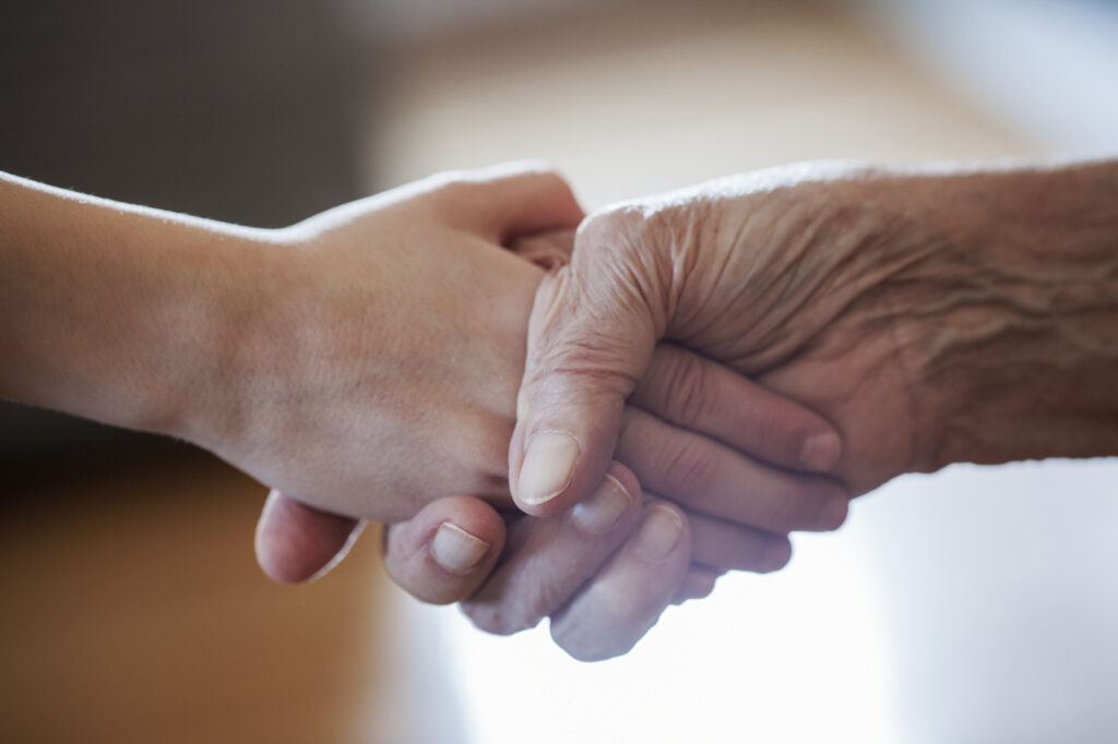 image of two people shaking hands to represent making an employee redundant